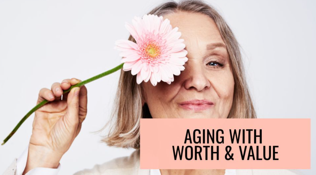 A happily smiling woman posing with a daisy held over one eye with the title "Aging with Worth and Value."