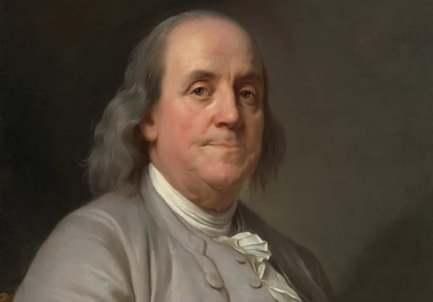 A painted portrait of Benjamin Franklin.