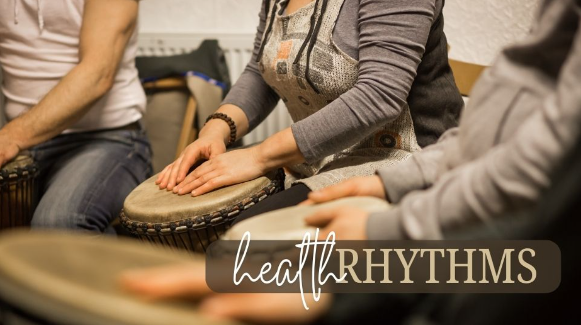 A few members sitting in a large circle with lap drums and other rhythm percussion instruments. A title logo "healthRhythms."