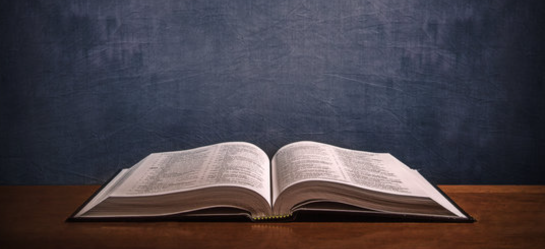 An image depicting the bible open on a table.