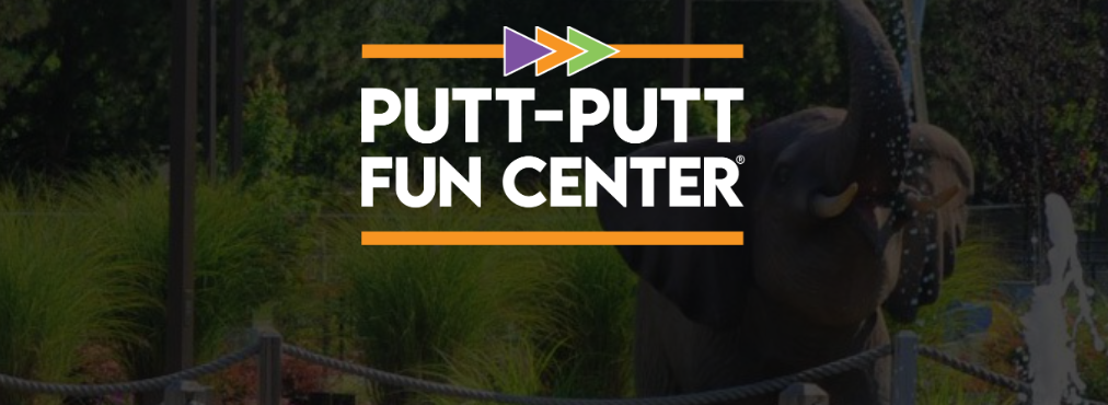 A photo of a large elephant statue in a putt-putt golf setting with a putt-putt fun center logo.